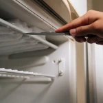 Papier aluminium installé dans congélateur pour éviter accumulation de givre